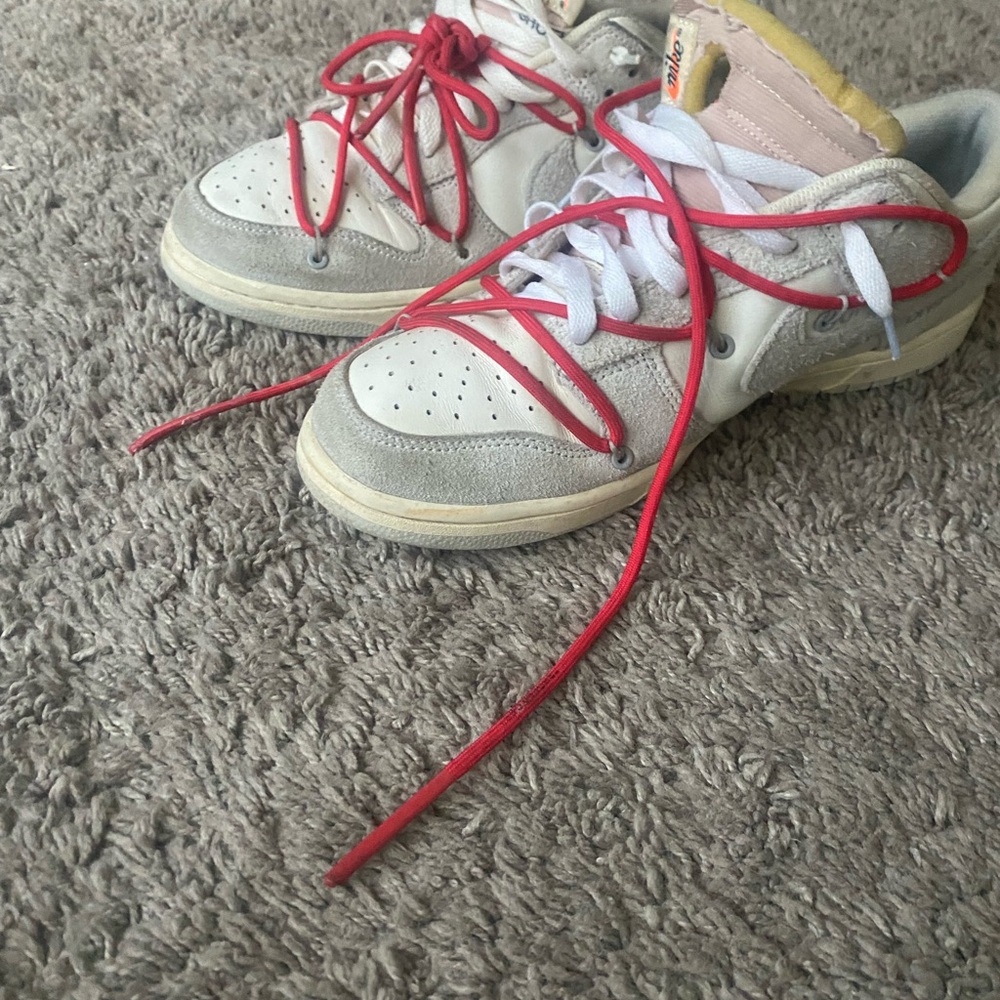 Off-White Sneakers with Red and White Accents